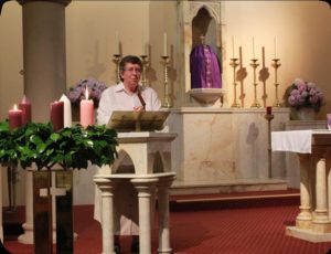 A woman speaking at church to the congregation